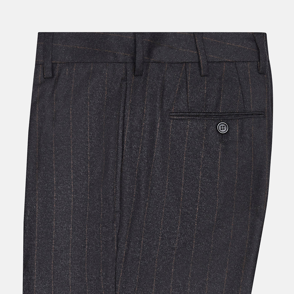 Turnbull & Asser’s Charcoal Pinstripe Edward Trousers, crafted in a wool-cotton blend with subtle vertical pinstripes, feature belt loops, a button closure, and tailored fit, all shown against a plain white background.