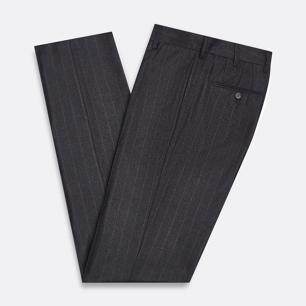 Turnbull & Asser’s Charcoal Pinstripe Edward Trousers, crafted in a wool-cotton blend with subtle vertical pinstripes, feature belt loops, a button closure, and tailored fit, all shown against a plain white background.