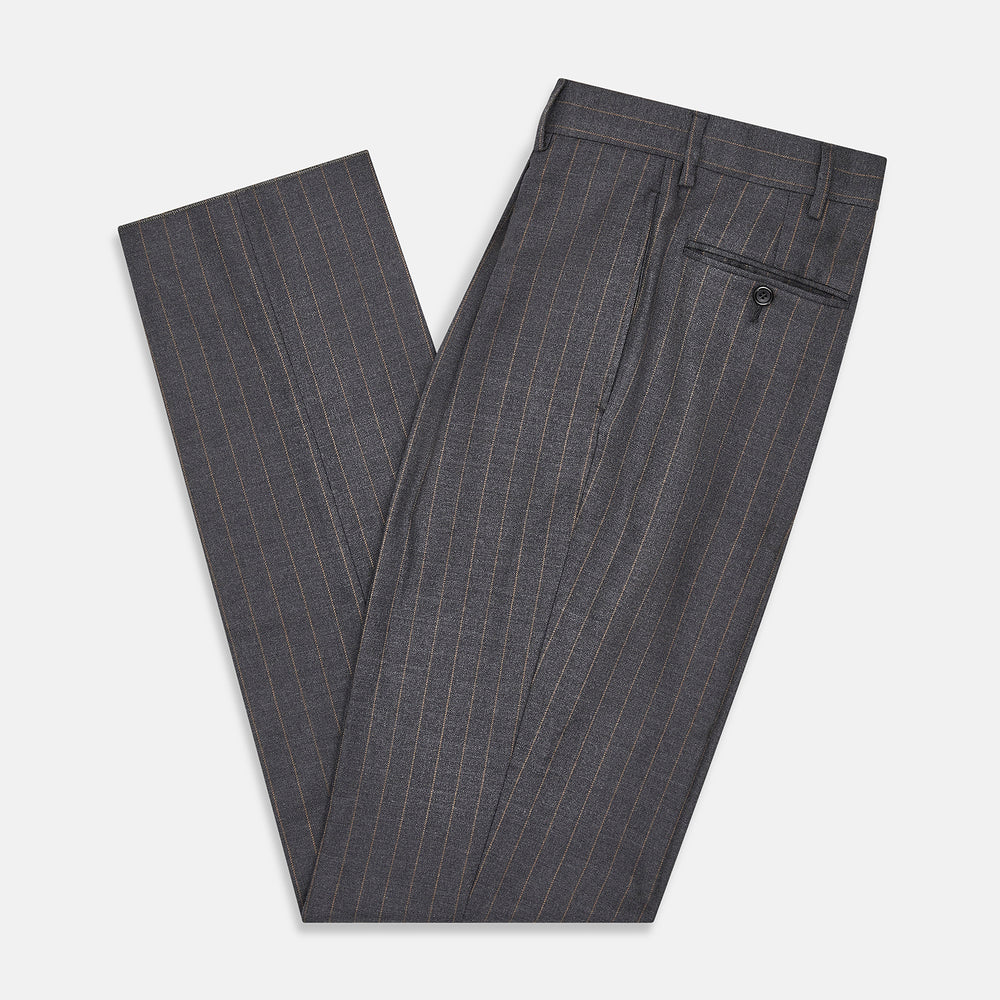 The Turnbull & Asser Dark Grey Pinstripe Arthur Trousers feature a subtle pinstripe, front button and zip closure, belt loops, and pleated front. These straight-leg trousers are shown against a plain white background.