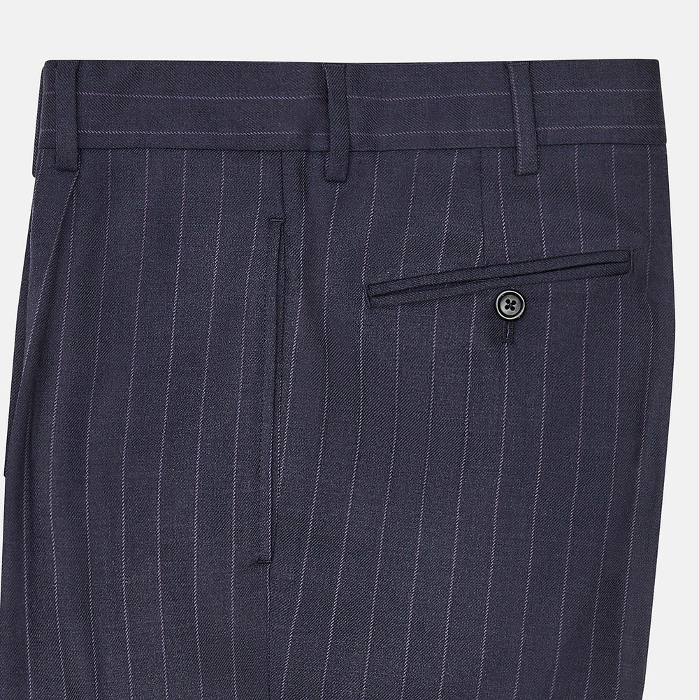 The Navy Pinstripe Arthur Trousers by Turnbull & Asser feature white vertical stripes, front pleats, a button closure, belt loops, and straight legs—adding modern menswear style to your wardrobe. Shown on a plain white background.