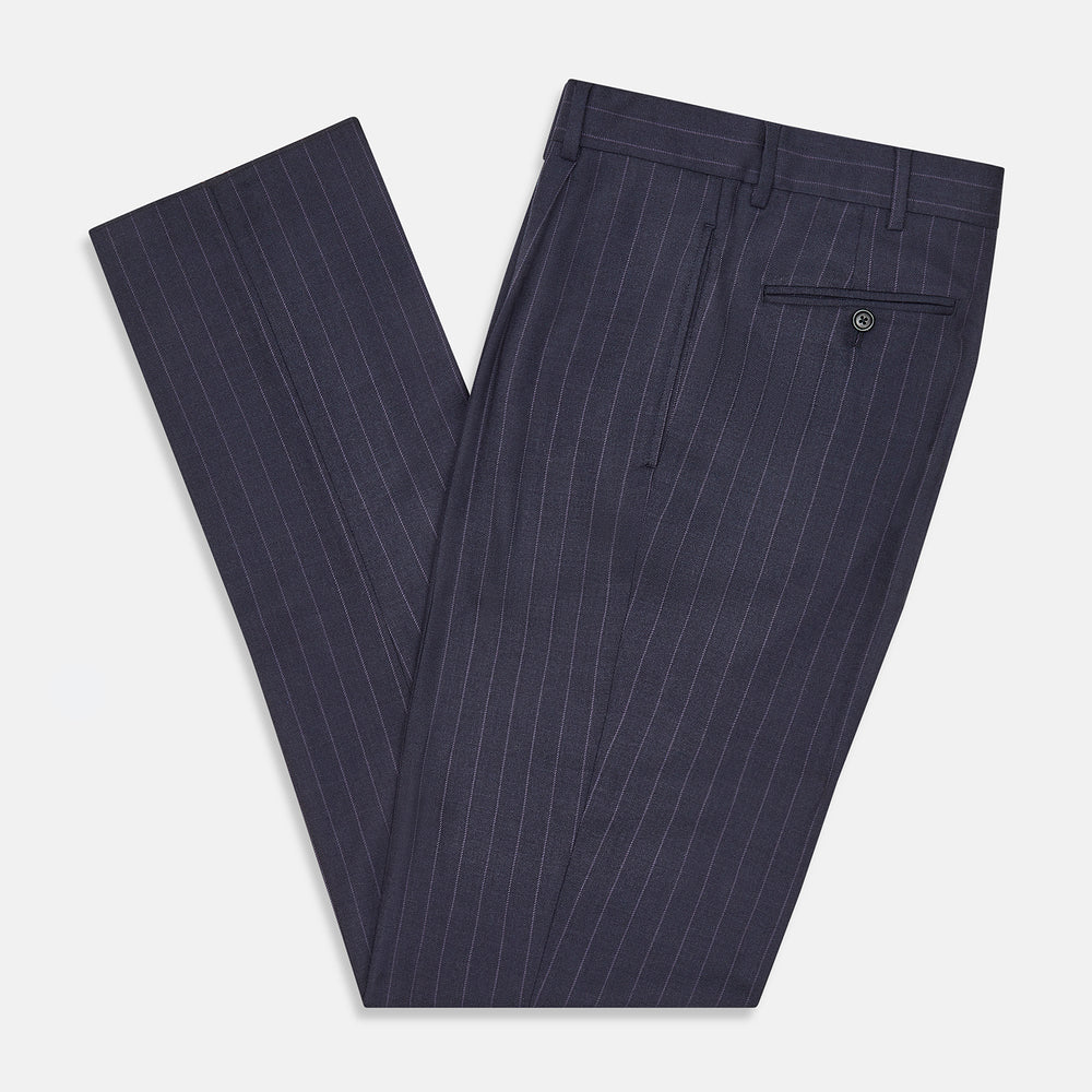 The Navy Pinstripe Arthur Trousers by Turnbull & Asser feature white vertical stripes, front pleats, a button closure, belt loops, and straight legs—adding modern menswear style to your wardrobe. Shown on a plain white background.