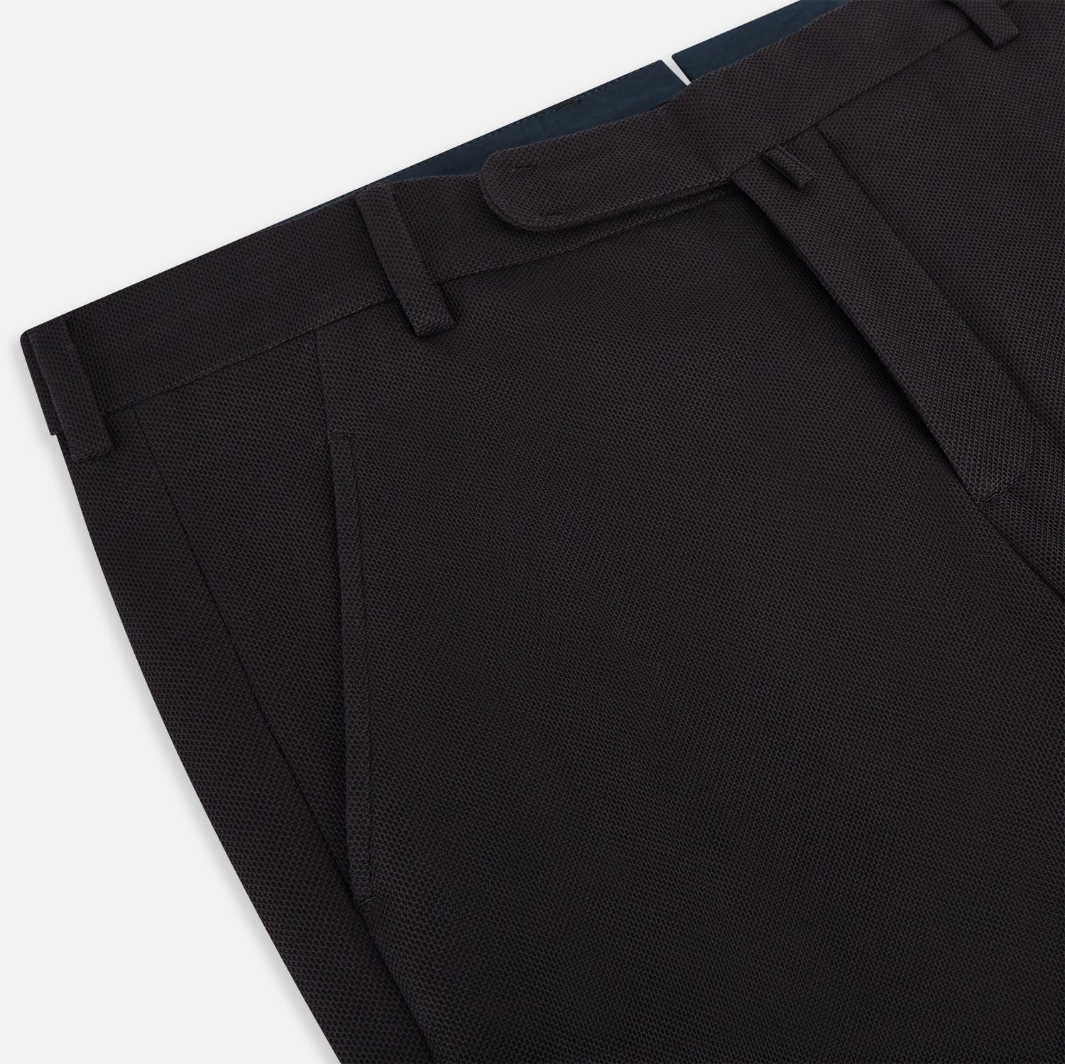 View 2 of product The Turnbull & Asser UK Dark Chocolate William Trousers are straight-leg dress pants with subtle pleats, belt loops, and a waistband, showcased against a plain white background.