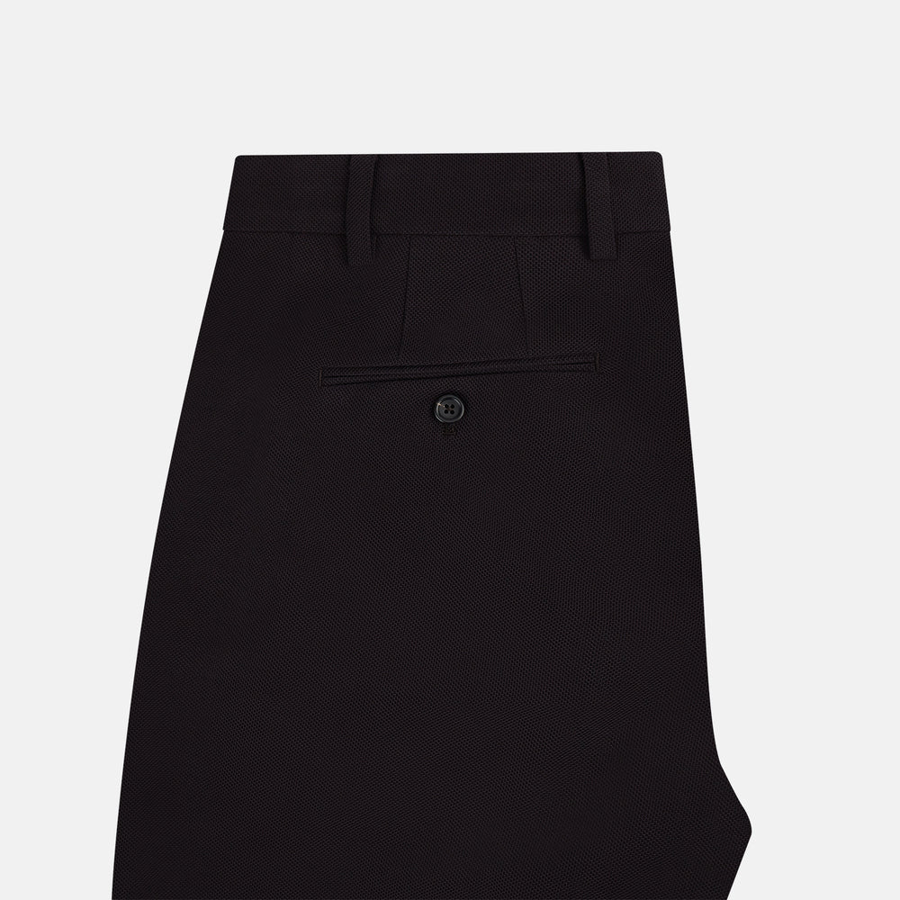 The Turnbull & Asser UK Dark Chocolate William Trousers are straight-leg dress pants with subtle pleats, belt loops, and a waistband, showcased against a plain white background.