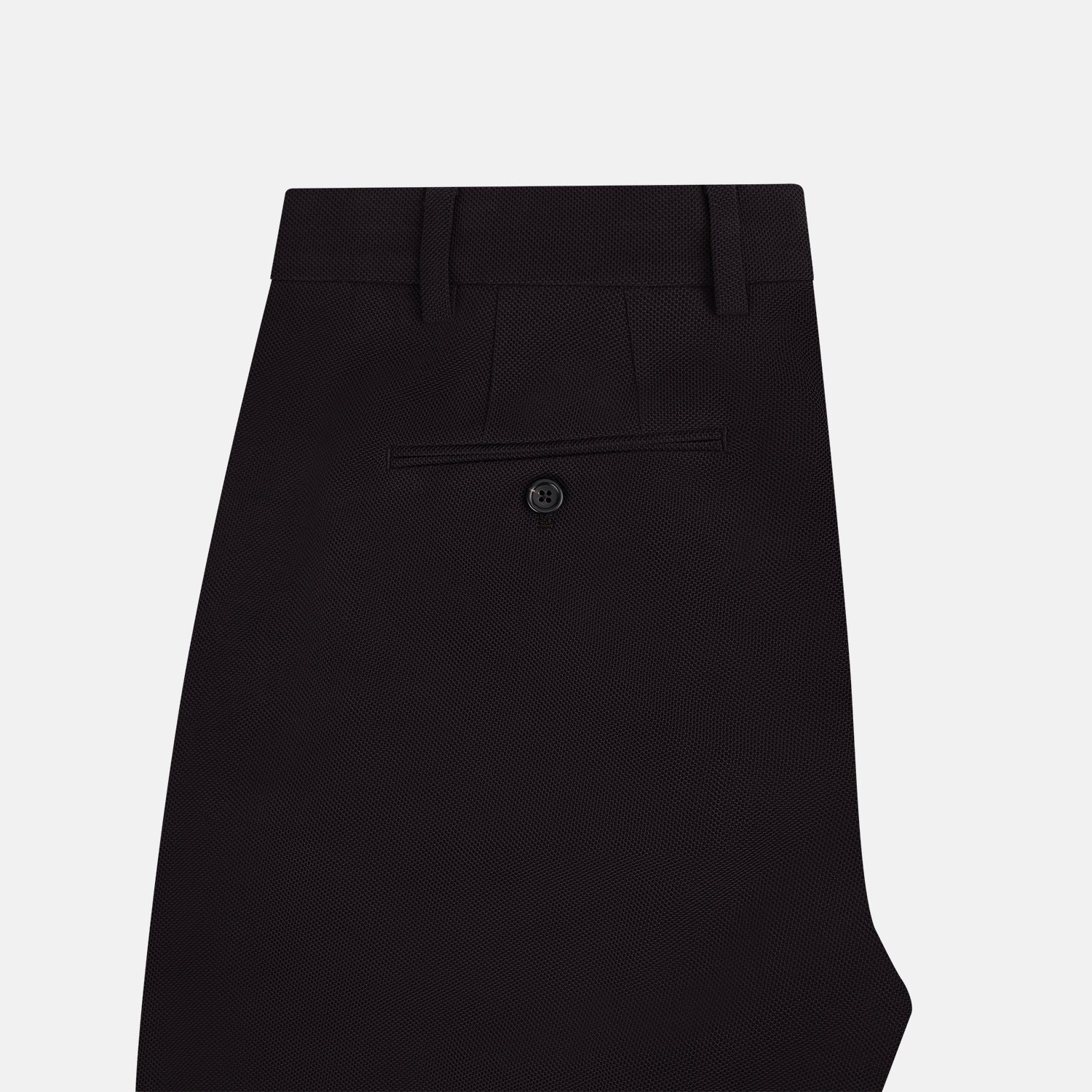 View 5 of product The Turnbull & Asser UK Dark Chocolate William Trousers are straight-leg dress pants with subtle pleats, belt loops, and a waistband, showcased against a plain white background.