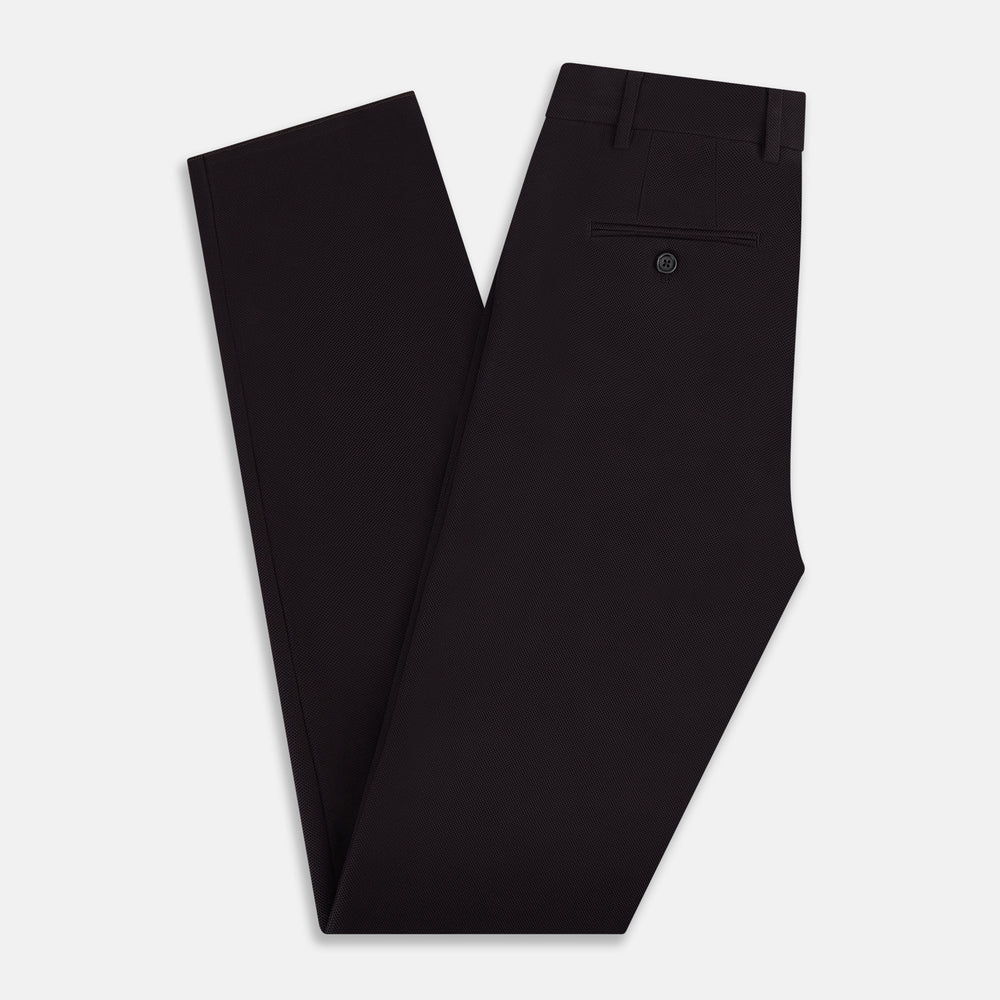 The Turnbull & Asser UK Dark Chocolate William Trousers are straight-leg dress pants with subtle pleats, belt loops, and a waistband, showcased against a plain white background.