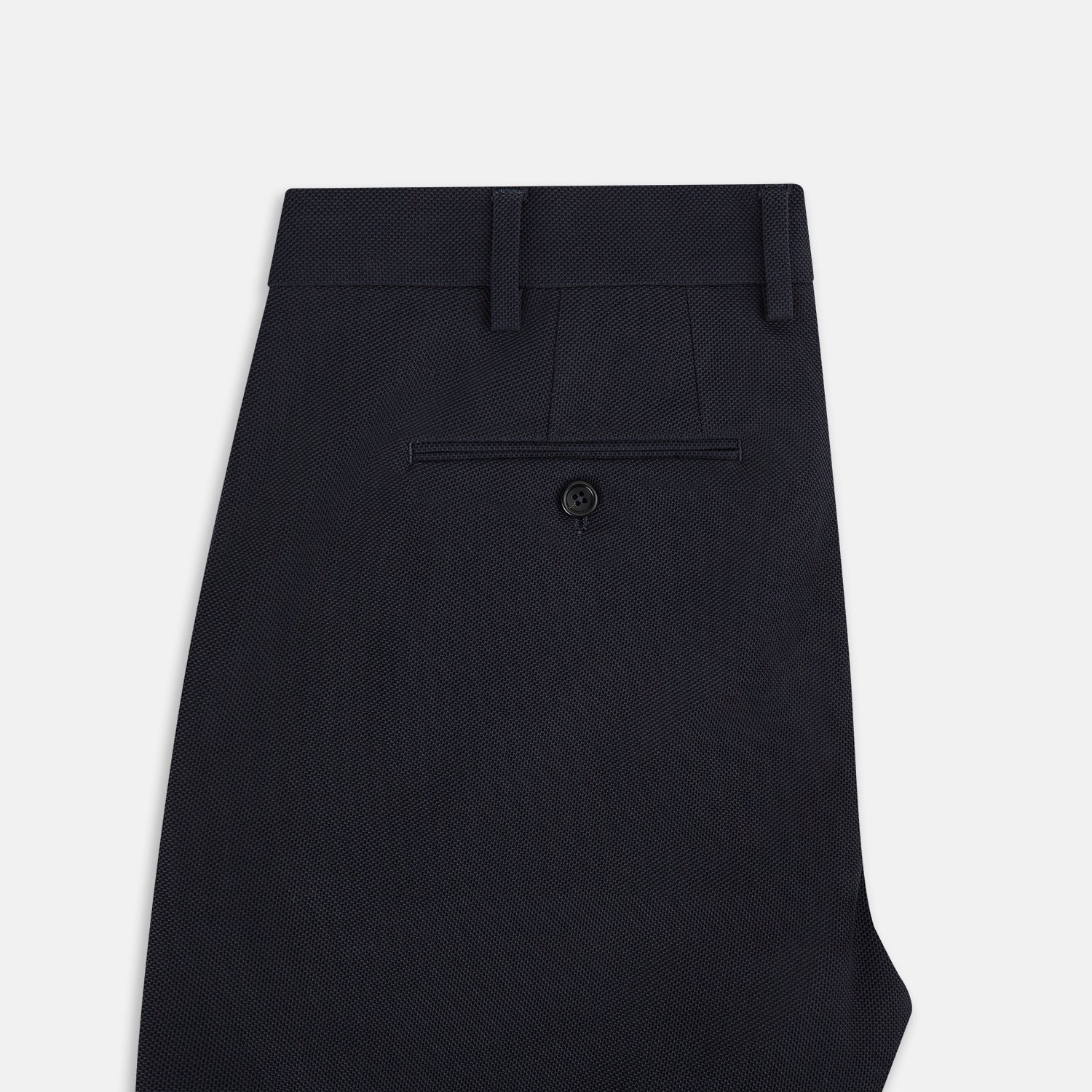 View 4 of product The Charcoal William Trousers by Turnbull & Asser UK feature a straight-leg cut, belt loops, and a flat front in classic dark navy blue, styled like traditional charcoal dress pants and shown on a plain white background.