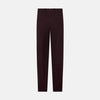 View 3 of product A pair of Burgundy Knitted London Trousers by Turnbull & Asser, featuring a tailored fit, button closure, front pleats, belt loops, and straight legs, displayed on a plain white background.