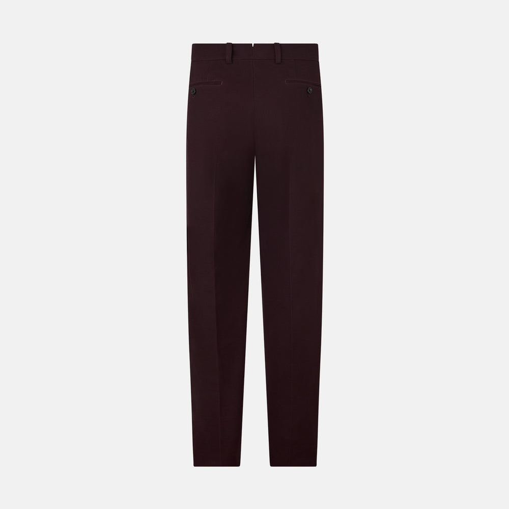 A pair of Burgundy Knitted London Trousers by Turnbull & Asser, featuring a tailored fit, button closure, front pleats, belt loops, and straight legs, displayed on a plain white background.