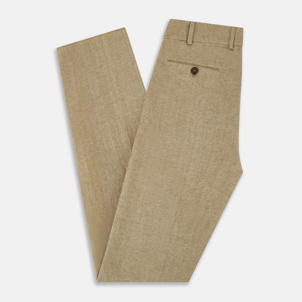 The Sand Linen Amberley Trousers by Turnbull & Asser UK are high-waisted, straight-leg, light brown herringbone linen trousers with belt loops, a front button, and zip closure, shown against a plain white background.