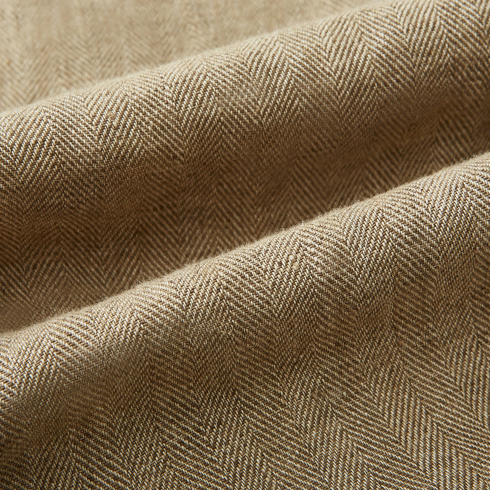 The Sand Linen Amberley Trousers by Turnbull & Asser UK are high-waisted, straight-leg, light brown herringbone linen trousers with belt loops, a front button, and zip closure, shown against a plain white background.