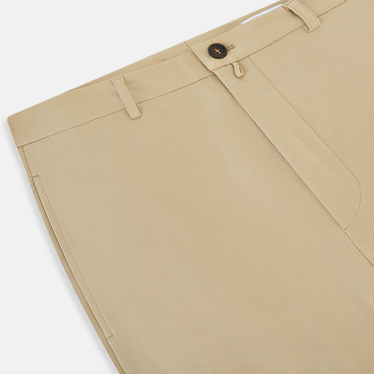 View 2 of product Amberley Sand Trousers in Cotton by Turnbull & Asser UK, featuring a straight-leg silhouette in beige cotton canvas with a button and zip closure, displayed against a plain white background.