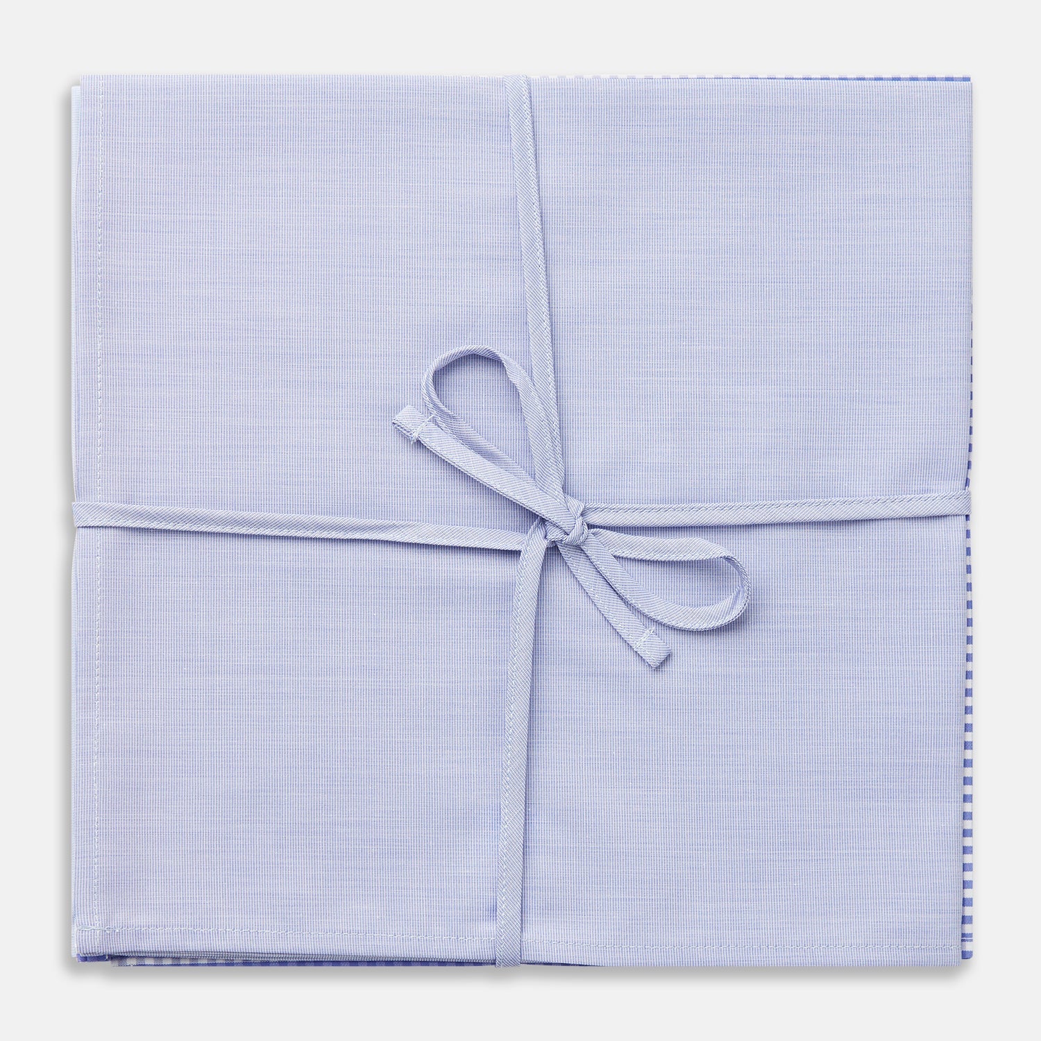 View 2 of product Turnbull & Asser's Blue Cotton Handkerchiefs 3-pack features three luxury designs—light blue, blue and white checks, and subtle stripes—elegantly displayed on a plain white background.