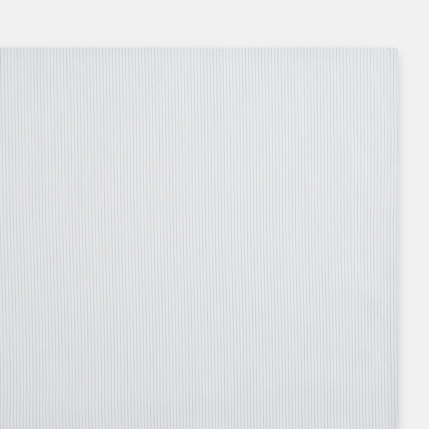 View 2 of product The Turnbull & Asser Blue Pencil Stripe Handkerchief is shown folded on a white background, highlighting its refined design as a perfect formal accessory.