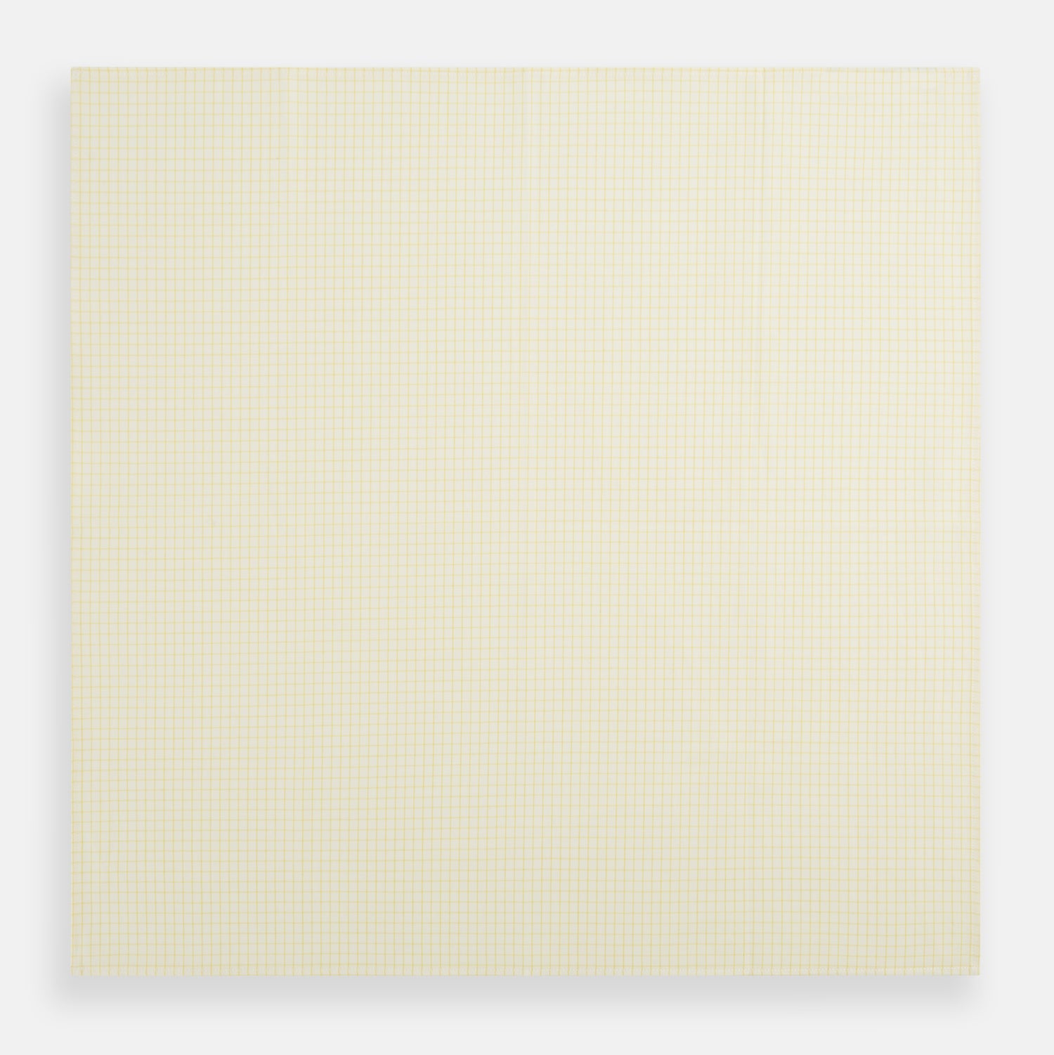 View 3 of product The Yellow Graph Check Handkerchief by Turnbull & Asser features a light yellow background with evenly spaced, thin yellow grid lines forming small squares—evoking the look of classic graph paper.