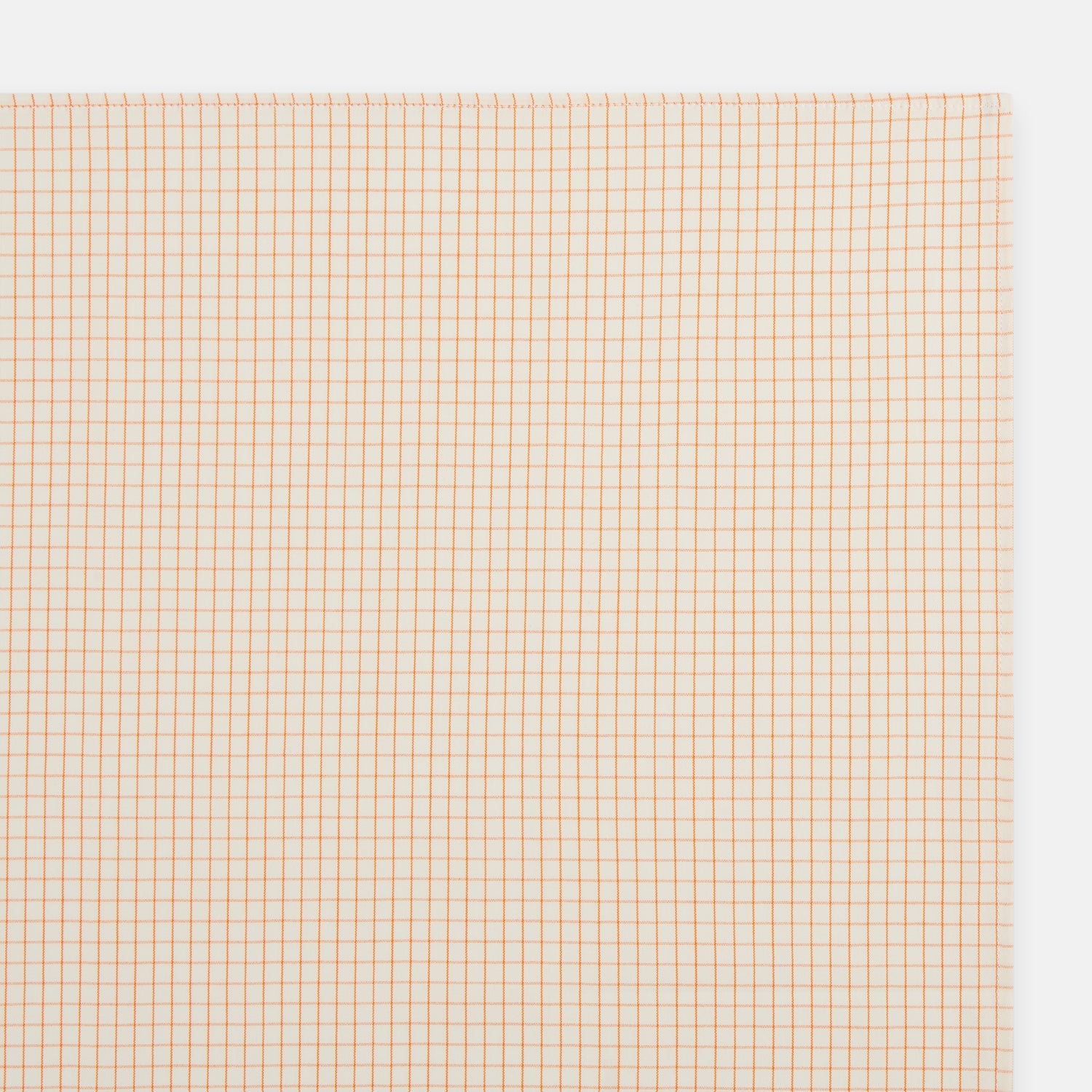 View 2 of product The Turnbull & Asser Orange Graph Check Handkerchief features a square cotton design with an orange and white graph check pattern, making it a stylish formal accessory.