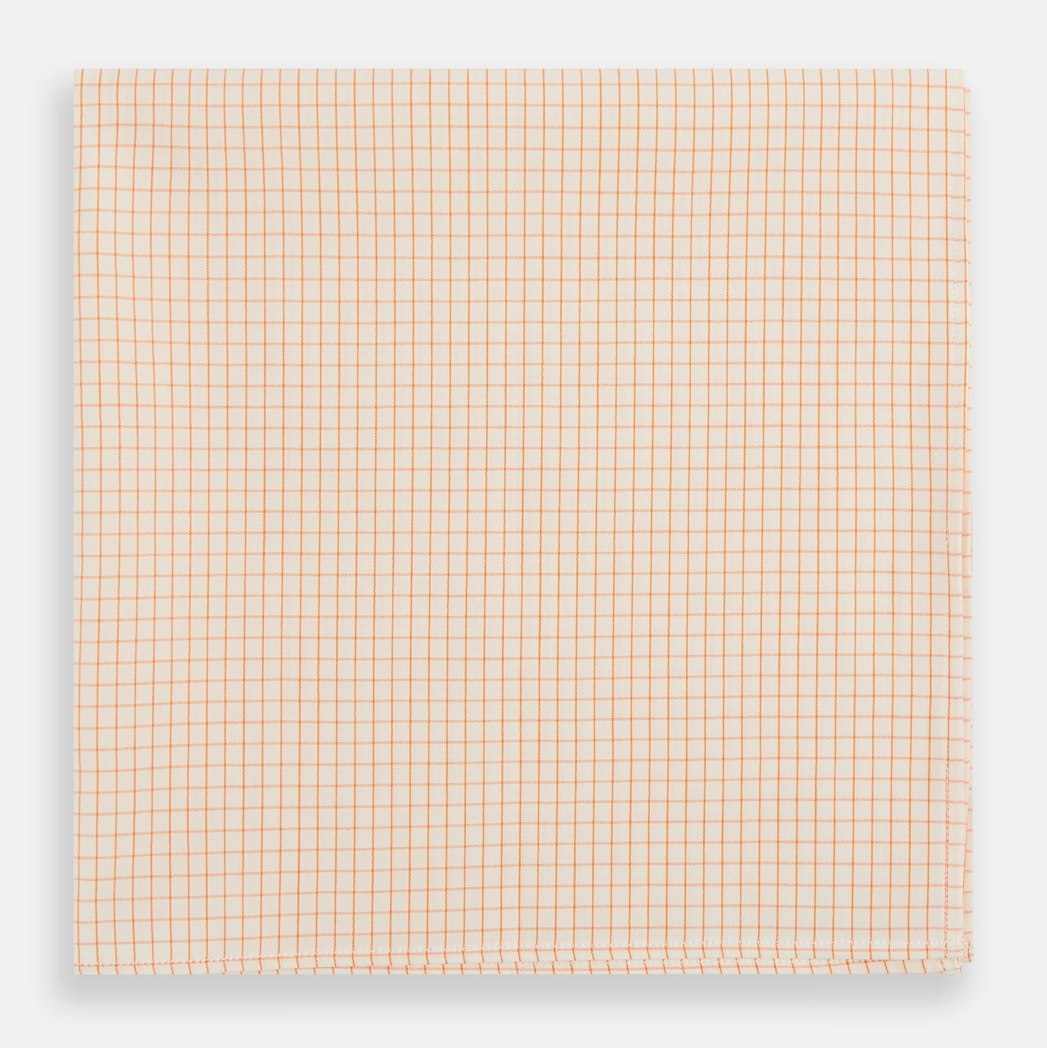 View 1 of product The Turnbull & Asser Orange Graph Check Handkerchief features a square cotton design with an orange and white graph check pattern, making it a stylish formal accessory.