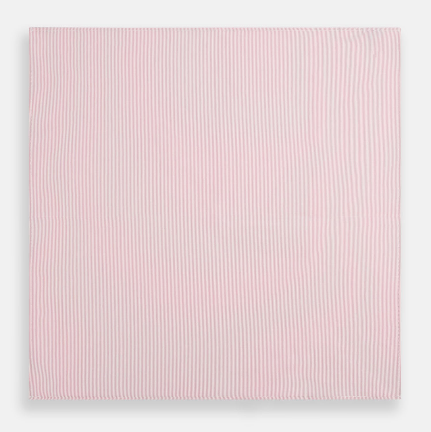View 3 of product The Turnbull & Asser Pink Pencil Stripe Handkerchief, crafted from soft cotton, is neatly folded and displayed on a white background—a sophisticated formal accessory for any occasion.