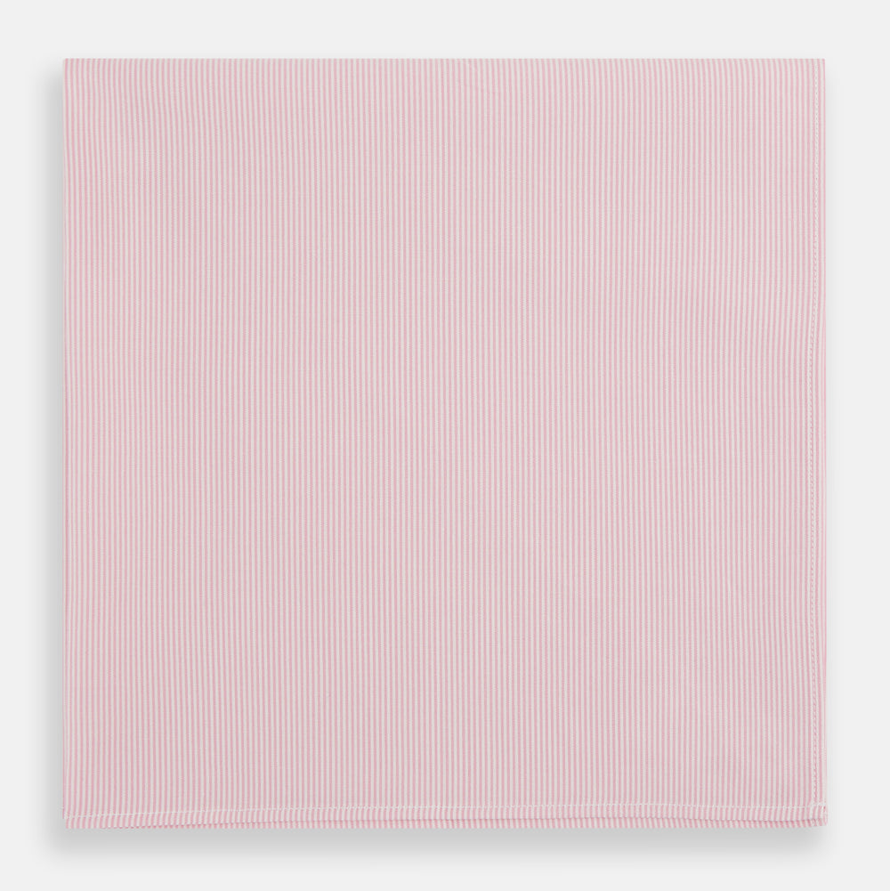 The Turnbull & Asser Pink Pencil Stripe Handkerchief, crafted from soft cotton, is neatly folded and displayed on a white background—a sophisticated formal accessory for any occasion.