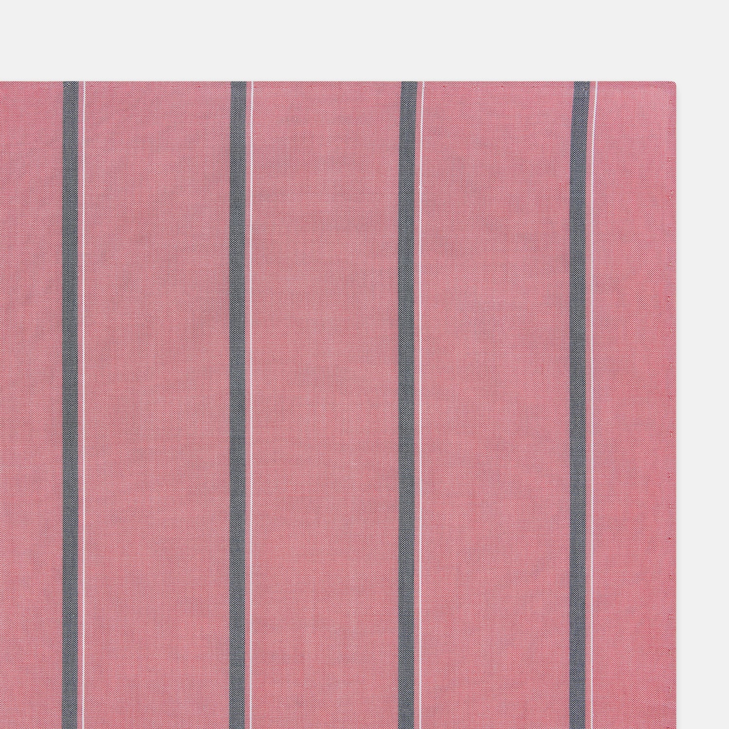 View 2 of product The Turnbull & Asser UK Coral Pink Track Stripe Hand-Rolled Handkerchief is a square accessory featuring evenly spaced dark gray and white vertical stripes on a coral pink background. Expertly crafted in England, it boasts elegant hand-rolled edges and is displayed against a plain white background.
