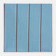 The Turnbull & Asser UK Cendre Blue Track Stripe Hand-Rolled Handkerchief is displayed folded against a plain background, showcasing its cendre blue color with a track stripe pattern—three vertical gray stripes and one thin light blue stripe—and expertly finished with meticulously hand-rolled edges.