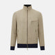 A Fairway Sand Golf Jacket in Linen by Turnbull & Asser UK, crafted from lightweight herringbone linen, features a front zipper, a chest zip pocket, two side zip pockets, and dark navy cuffs, collar lining, and waistband. Shown on a plain white background.