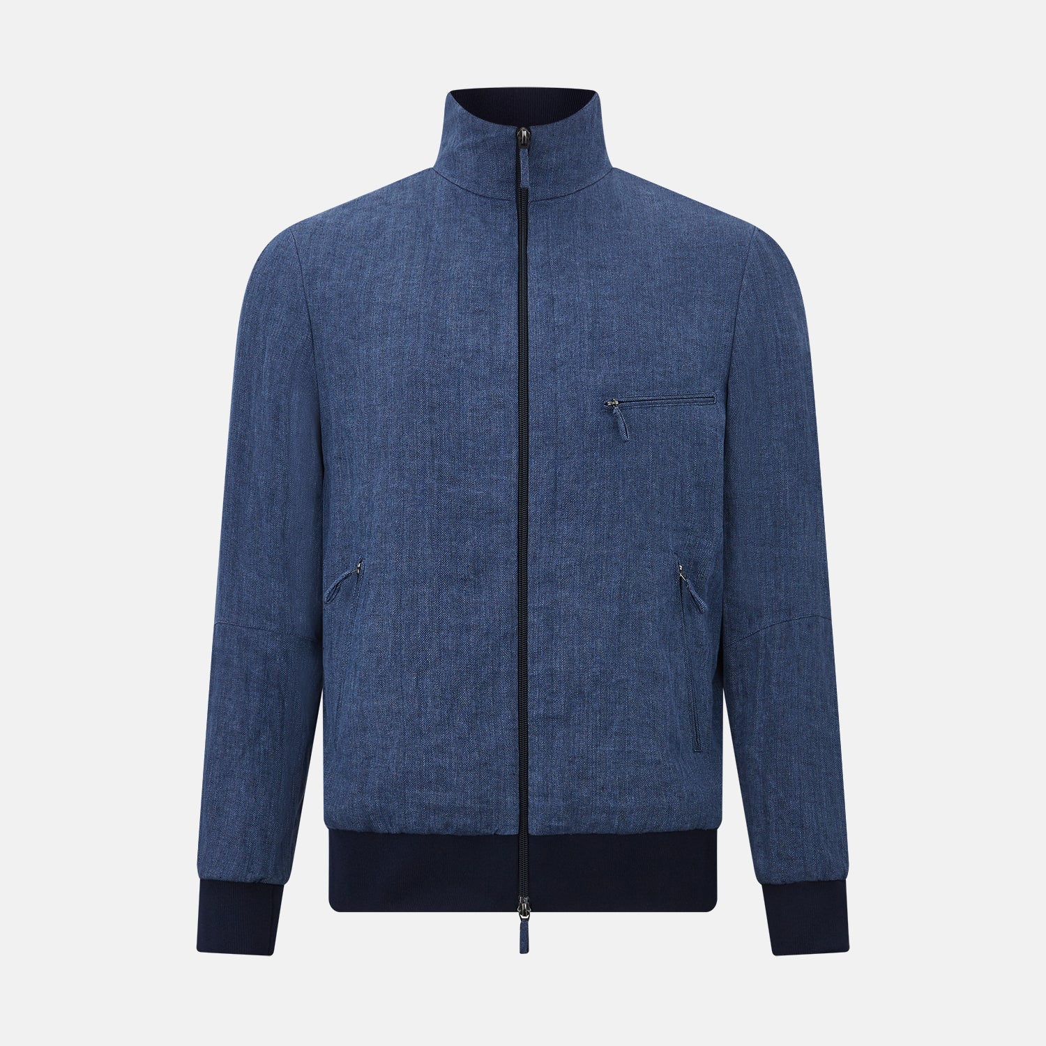 View 1 of product Introducing the Fairway Denim Golf Jacket in Linen by Turnbull & Asser UK—a blue zip-up jacket featuring a high collar, two side pockets, and a zippered chest pocket. The contrasting darker cuffs and hem accentuate its denim-like linen texture, making it the perfect versatile golf jacket for cooler days.
