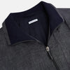 View 2 of product A front view of the Fairway Ash Golf Jacket in Linen by Turnbull & Asser UK is shown, featuring a high collar, two side zip pockets, a chest zip pocket, and black ribbed cuffs and hem. Crafted from lightweight gray herringbone linen for effortless warm-weather dressing, the jacket is displayed on a plain white background.