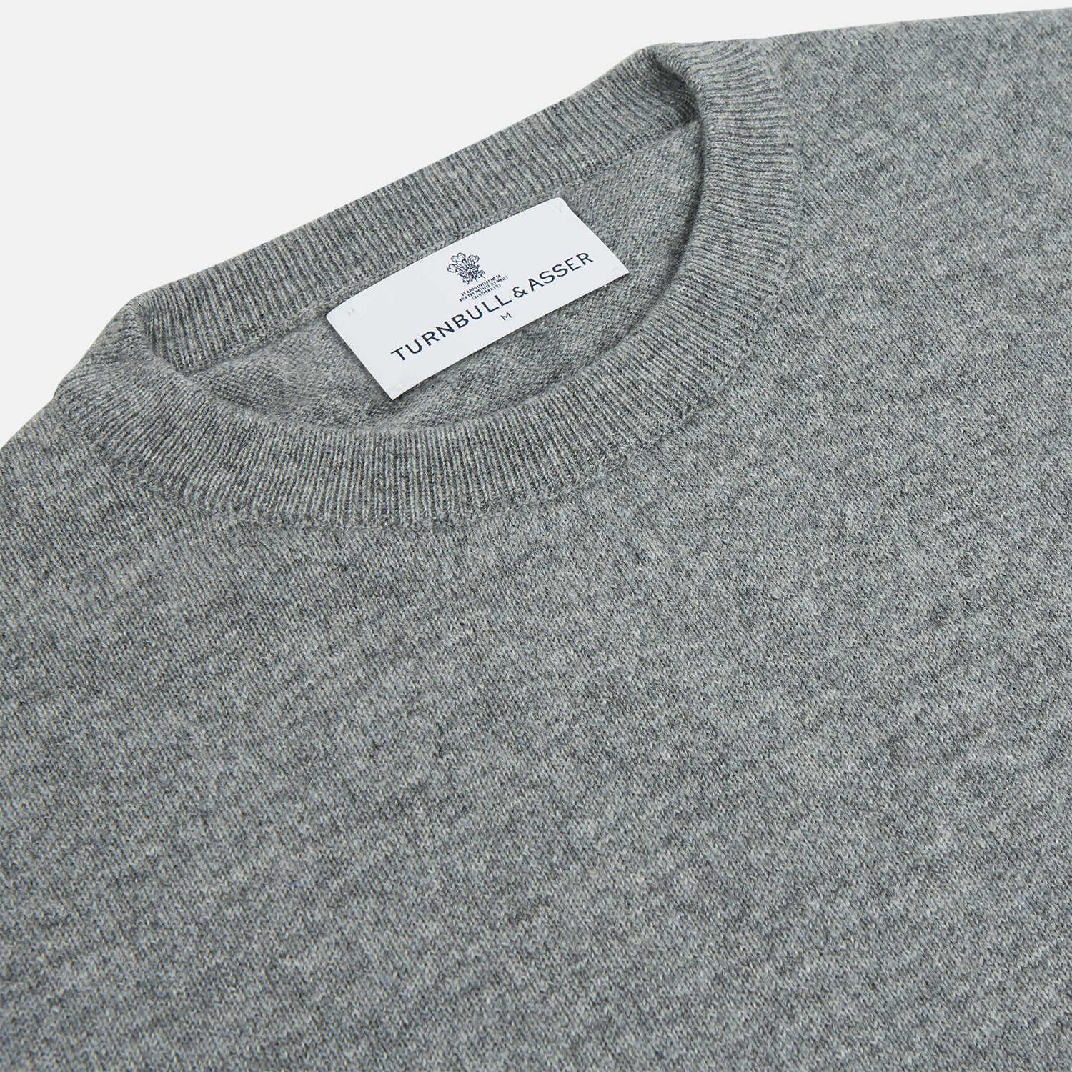 View 2 of product The Turnbull & Asser Flannel Grey Crew Neck Cashmere Jumper is shown flat on a white background.