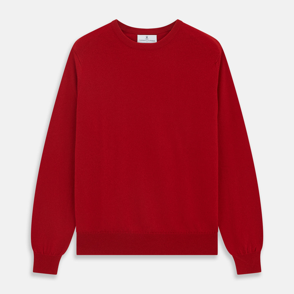 The Turnbull & Asser Deep Red Crew Neck Cashmere Jumper features long sleeves and a plain, solid hue—luxuriously soft and ideal for smart casual style. Displayed flat on a white background.