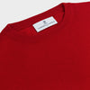 View 2 of product The Turnbull & Asser Deep Red Crew Neck Cashmere Jumper features long sleeves and a plain, solid hue—luxuriously soft and ideal for smart casual style. Displayed flat on a white background.