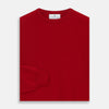View 3 of product The Turnbull & Asser Deep Red Crew Neck Cashmere Jumper features long sleeves and a plain, solid hue—luxuriously soft and ideal for smart casual style. Displayed flat on a white background.