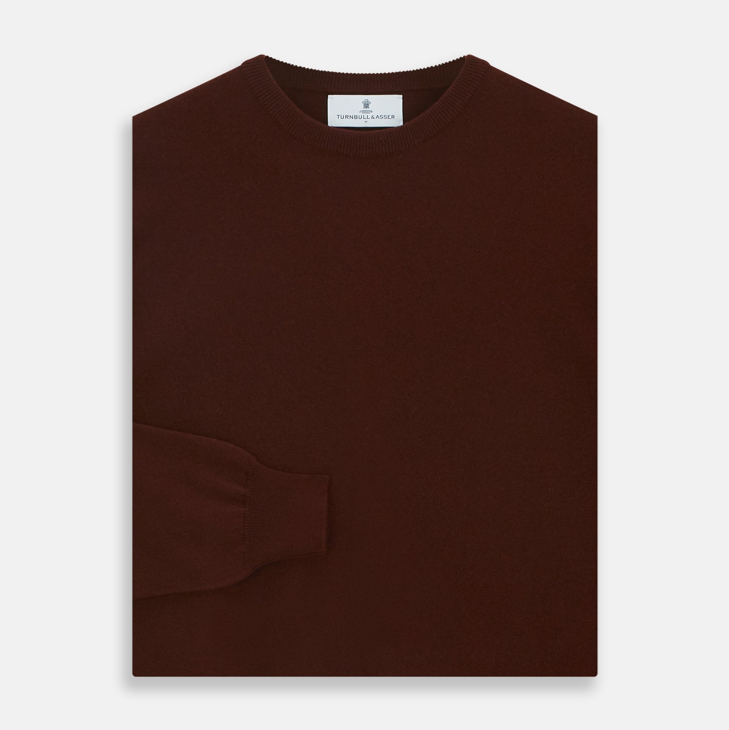 View 3 of product The Turnbull & Asser Port Cashmere Crew Neck Jumper, in dark brown, features a plain design with long sleeves and is shown laid flat on a white background.