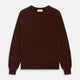 The Turnbull & Asser Port Cashmere Crew Neck Jumper, in dark brown, features a plain design with long sleeves and is shown laid flat on a white background.