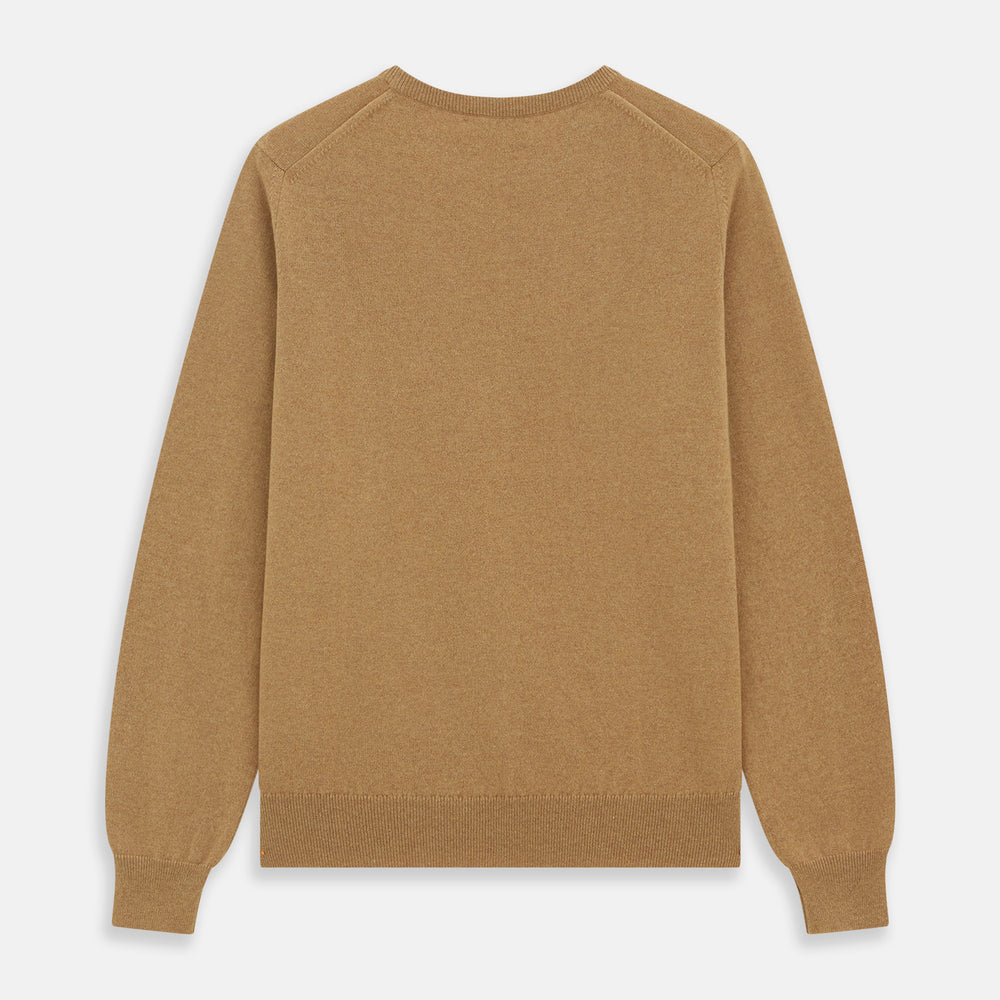 The Turnbull & Asser Camel Crew Neck Merino Wool Jumper is a classic, long-sleeve sweater in camel, laid flat on a white background. Featuring ribbed collar, cuffs, and hem, it’s an essential staple for every gentleman’s wardrobe.
