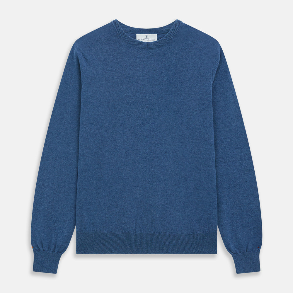 The Turnbull & Asser Blue Crew Neck Cashmere Jumper is laid flat on a white background, showcasing ribbed cuffs, hem, and neckline for an elegant, smart-casual style.