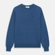 The Turnbull & Asser Blue Crew Neck Cashmere Jumper is laid flat on a white background, showcasing ribbed cuffs, hem, and neckline for an elegant, smart-casual style.