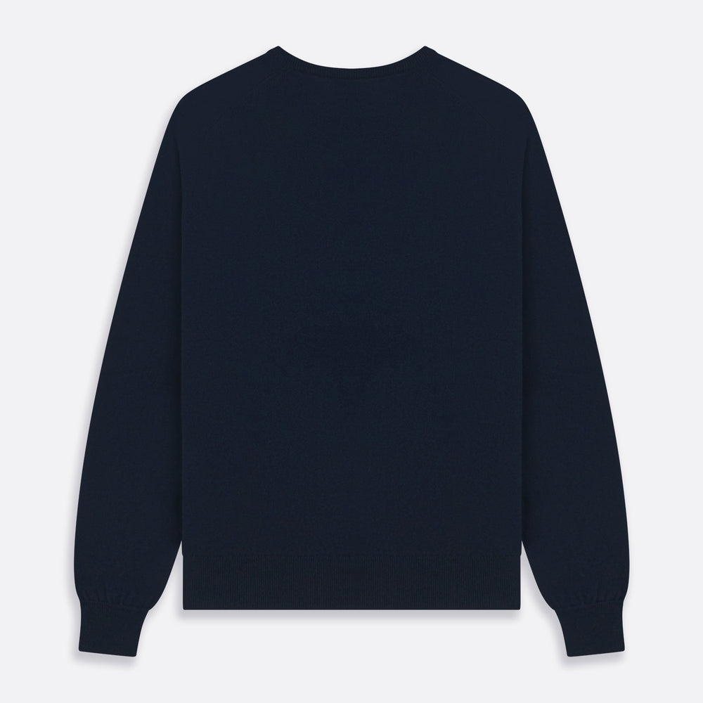 The Turnbull & Asser Navy V-Neck Cashmere Jumper, featuring long sleeves and ribbed cuffs and hem, is laid flat on a white background, showcasing its simple and classic design.
