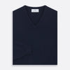 View 3 of product The Turnbull & Asser Navy V-Neck Cashmere Jumper, featuring long sleeves and ribbed cuffs and hem, is laid flat on a white background, showcasing its simple and classic design.