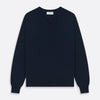View 1 of product The Turnbull & Asser Navy V-Neck Cashmere Jumper, featuring long sleeves and ribbed cuffs and hem, is laid flat on a white background, showcasing its simple and classic design.