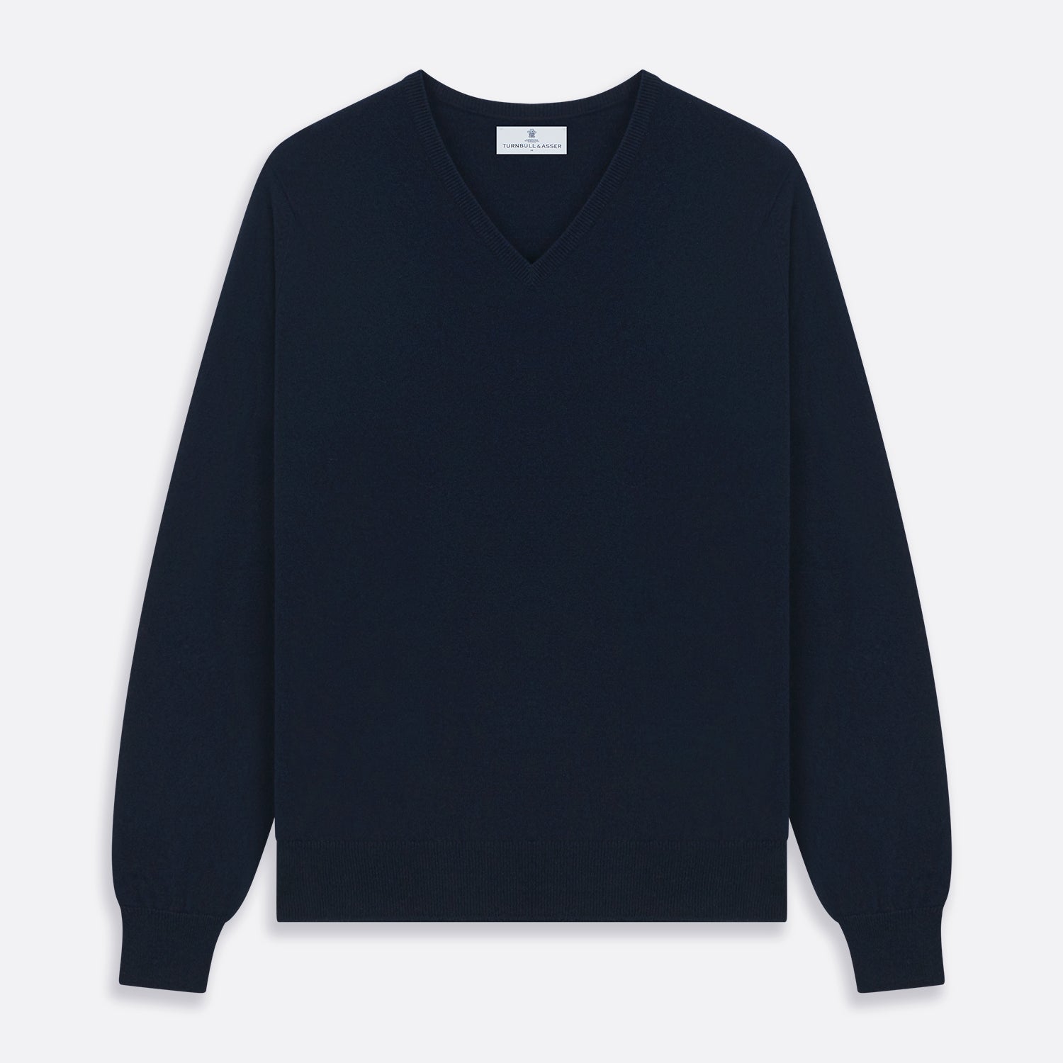 View 1 of product The Turnbull & Asser Navy V-Neck Cashmere Jumper, featuring long sleeves and ribbed cuffs and hem, is laid flat on a white background, showcasing its simple and classic design.