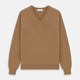 The Turnbull & Asser Natural V-Neck Cashmere Jumper, in camel, features long sleeves and ribbed cuffs, hem, and neckline. Crafted from Scottish cashmere, it’s laid flat on a white background for a refined smart casual look.
