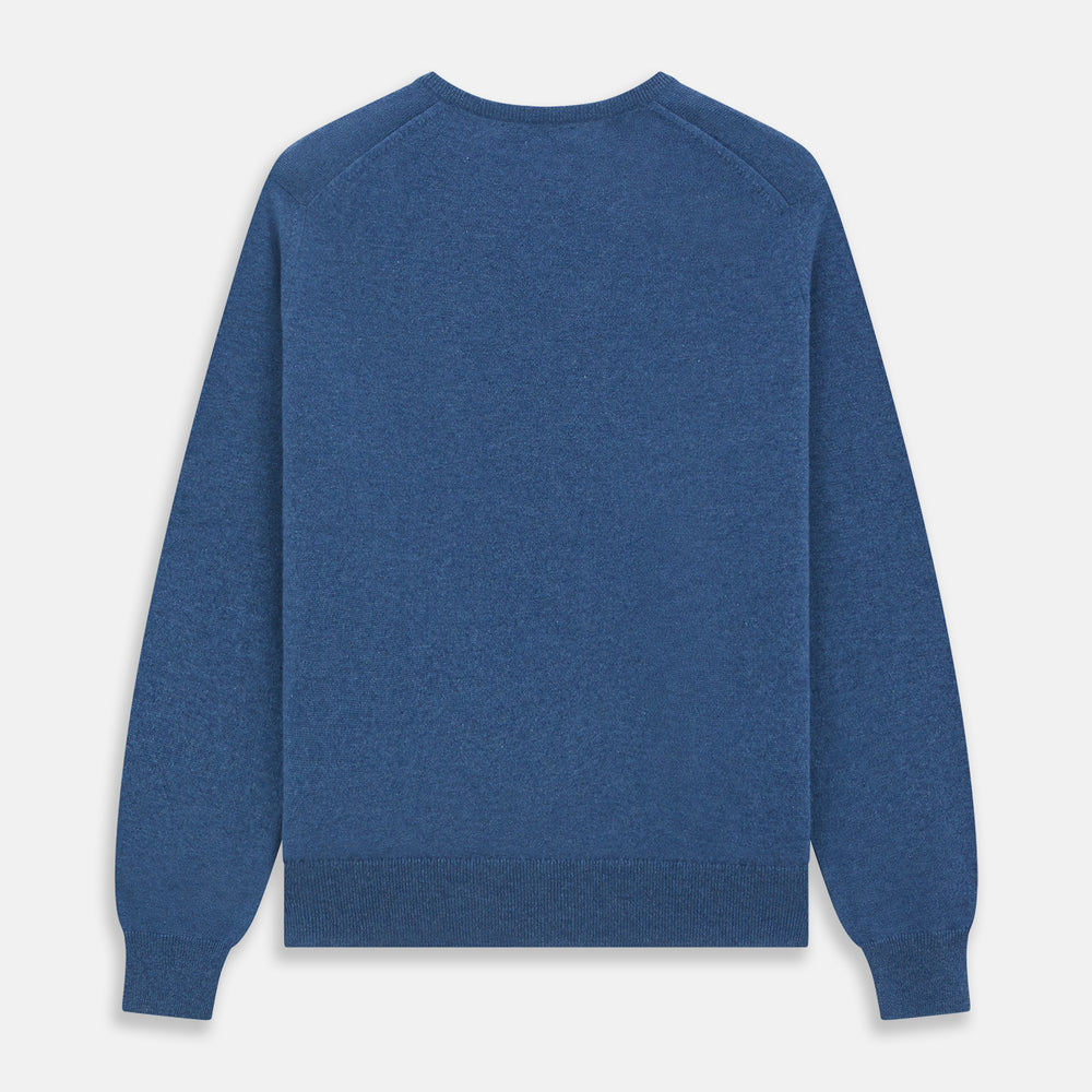 The Turnbull & Asser Blue V-Neck Cashmere Jumper, crafted from soft Scottish cashmere with ribbed cuffs, hem, and neckline, is shown laid flat on a white background for a refined smart-casual appeal.