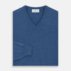View 3 of product The Turnbull & Asser Blue V-Neck Cashmere Jumper, crafted from soft Scottish cashmere with ribbed cuffs, hem, and neckline, is shown laid flat on a white background for a refined smart-casual appeal.