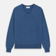 The Turnbull & Asser Blue V-Neck Cashmere Jumper, crafted from soft Scottish cashmere with ribbed cuffs, hem, and neckline, is shown laid flat on a white background for a refined smart-casual appeal.