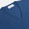 View 2 of product The Turnbull & Asser Blue V-Neck Cashmere Jumper, crafted from soft Scottish cashmere with ribbed cuffs, hem, and neckline, is shown laid flat on a white background for a refined smart-casual appeal.