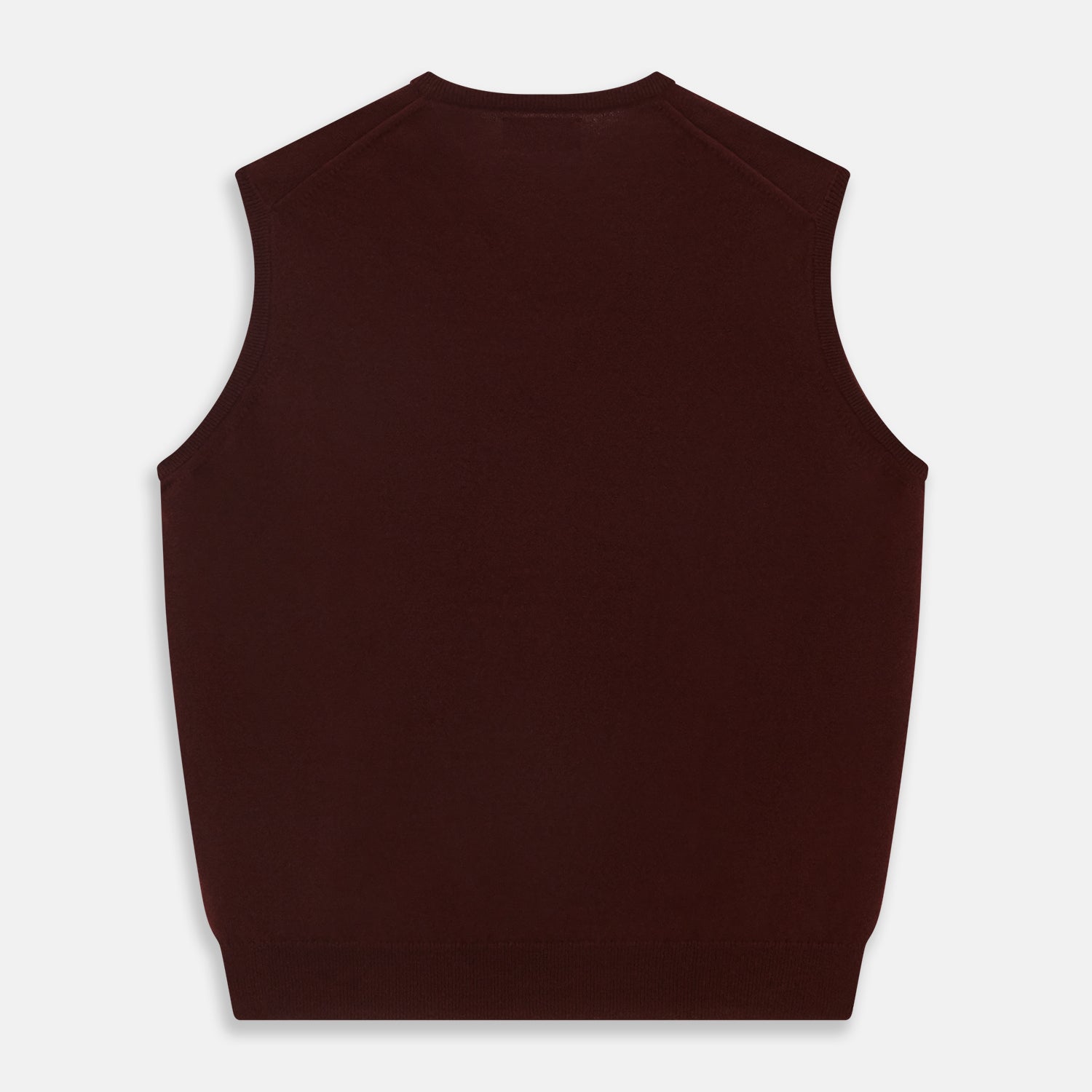 View 3 of product The Turnbull & Asser Port V-Neck Cashmere Slipover is a sleeveless, dark maroon vest with a simple design, shown laid flat on a white background—ideal for layering over a shirt or under a suit jacket.