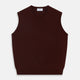 The Turnbull & Asser Port V-Neck Cashmere Slipover is a sleeveless, dark maroon vest with a simple design, shown laid flat on a white background—ideal for layering over a shirt or under a suit jacket.