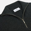 View 2 of product The Turnbull & Asser Charcoal Half-Zip Cashmere Jumper features long sleeves, a high collar, and a zip closure from the collar down the chest. Displayed flat with sleeves extended, it is crafted in dark charcoal grey cashmere.