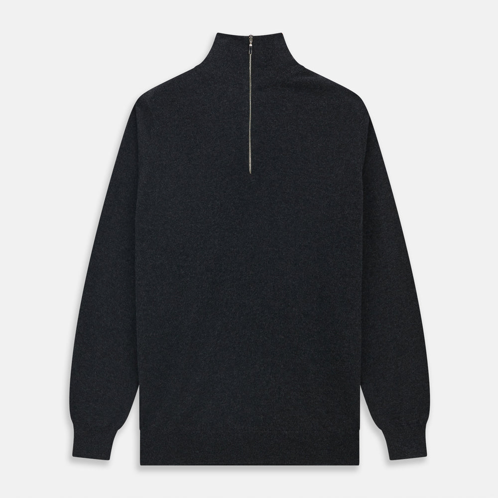 The Turnbull & Asser Charcoal Half-Zip Cashmere Jumper features long sleeves, a high collar, and a zip closure from the collar down the chest. Displayed flat with sleeves extended, it is crafted in dark charcoal grey cashmere.