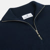 View 2 of product The Turnbull & Asser Navy Half-Zip Cashmere Jumper features a high collar and silver quarter-zip closure, shown flat on a white background.